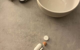 medication doses - four tablets on a concrete bench